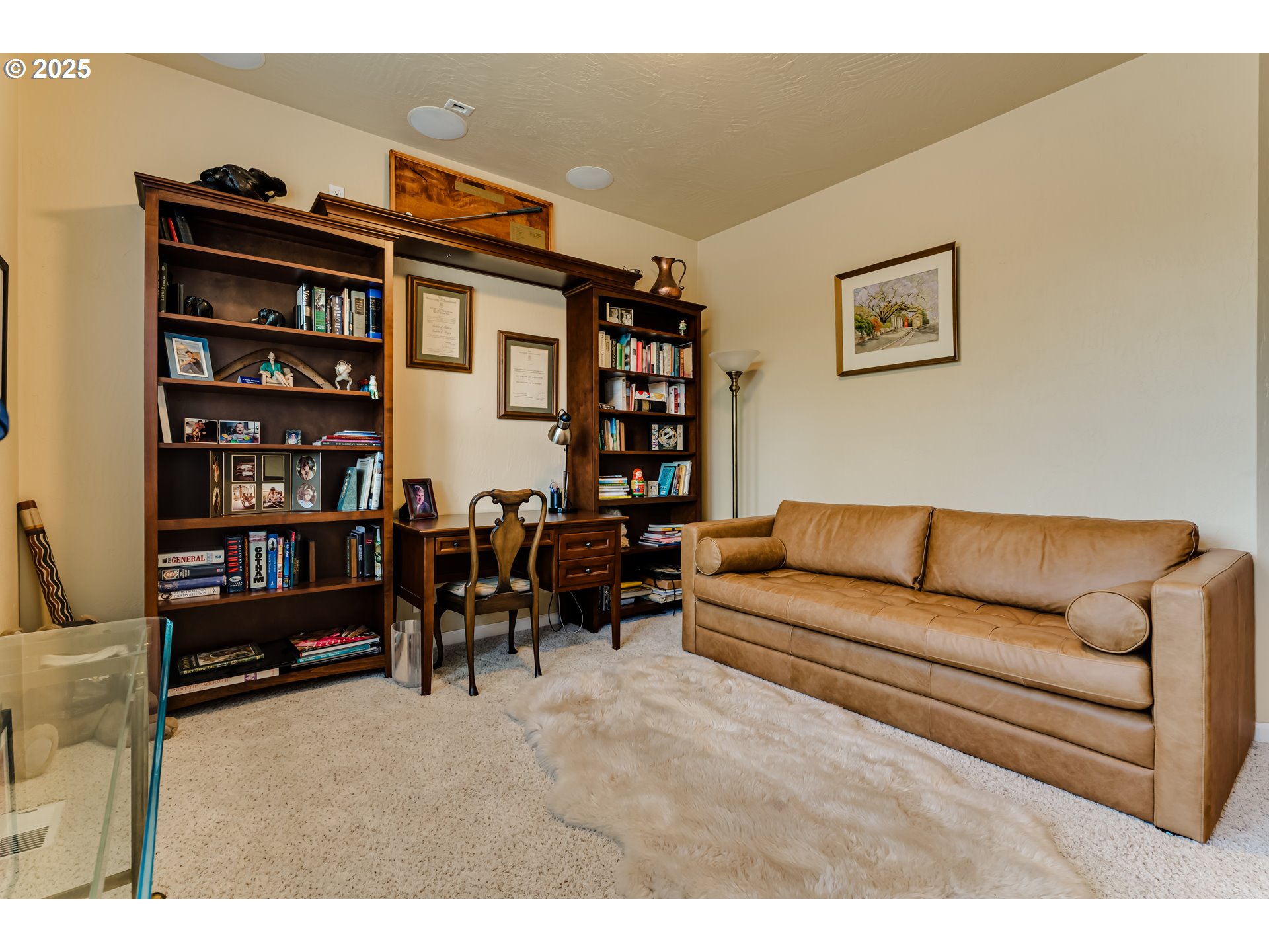 3351 Cape Hatteras Drive Eugene, OR 97408 - Photo 45 of 47 a living room with furniture and a bookshelf with wooden floor