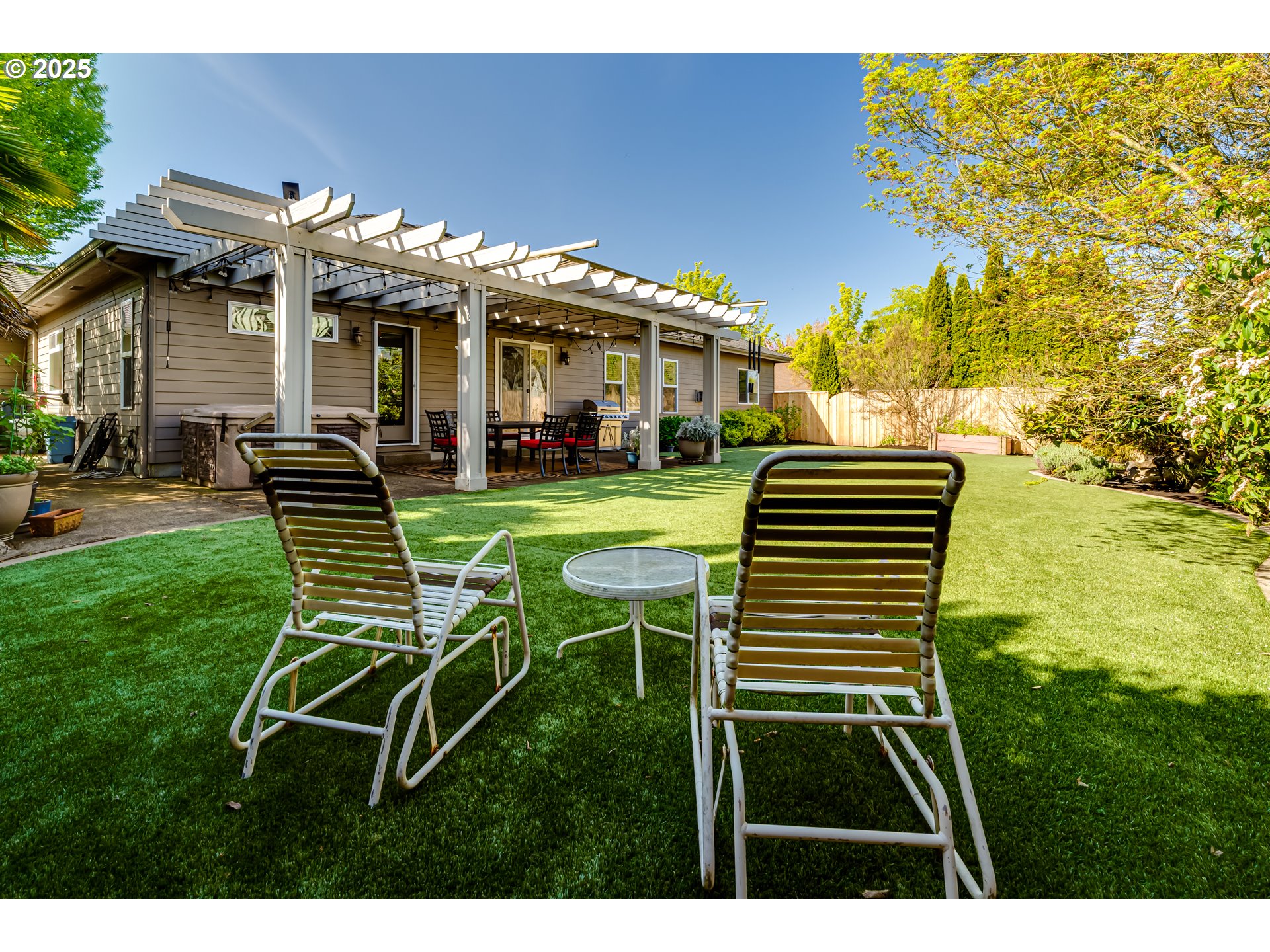 3351 Cape Hatteras Drive Eugene, OR 97408 - Photo 7 of 47 a view of a chair and tables in the patio next to a yard