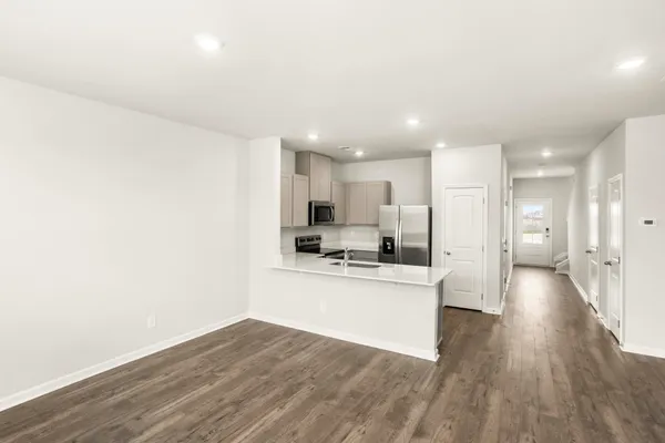 a view of kitchen with wooden floor
