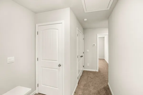 a view of a bathroom from the hallway