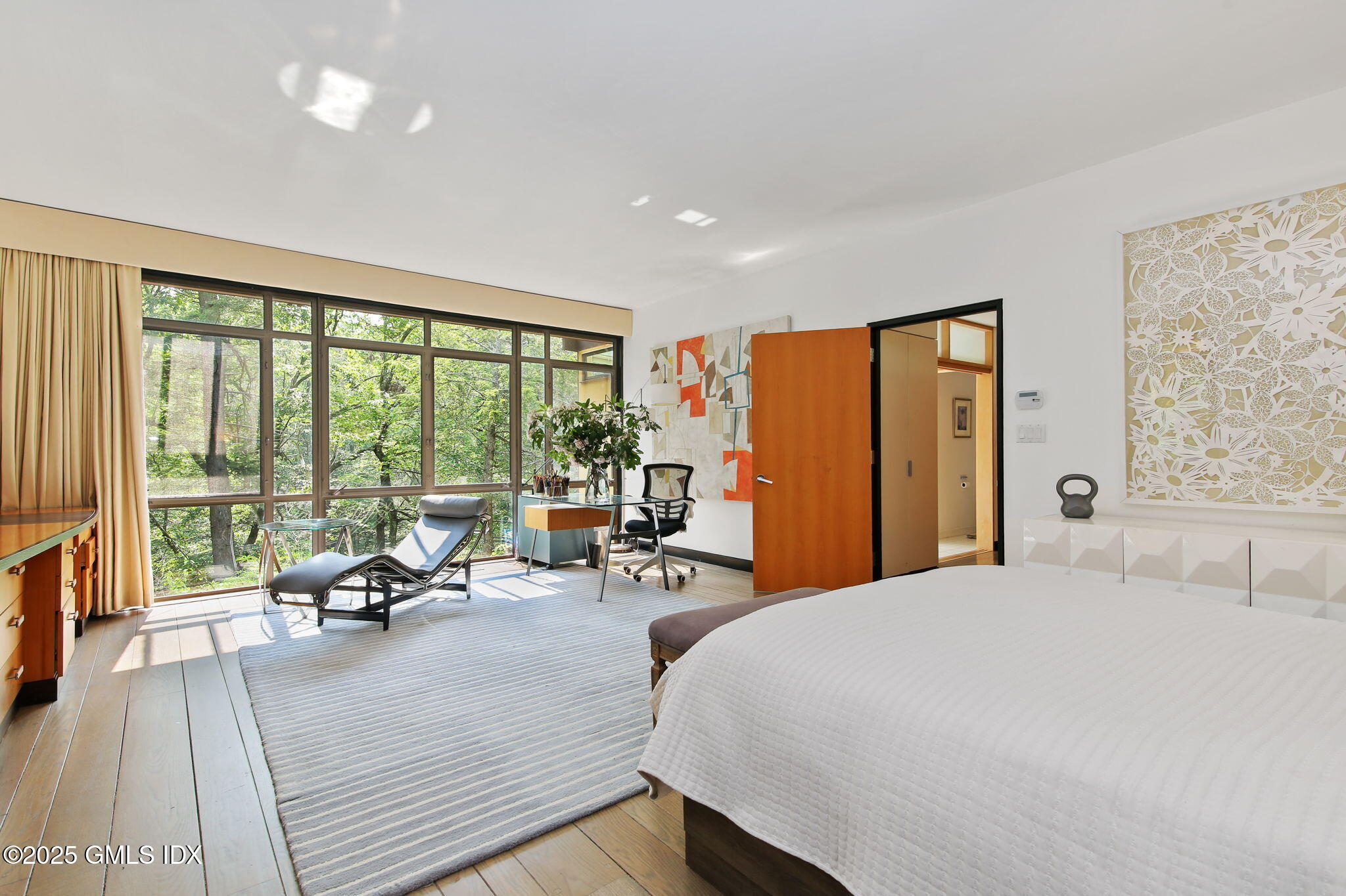 21 Hycliff Road Greenwich, CT 06831 - Photo 13 of 25 a view of a room with gym equipment and large windows