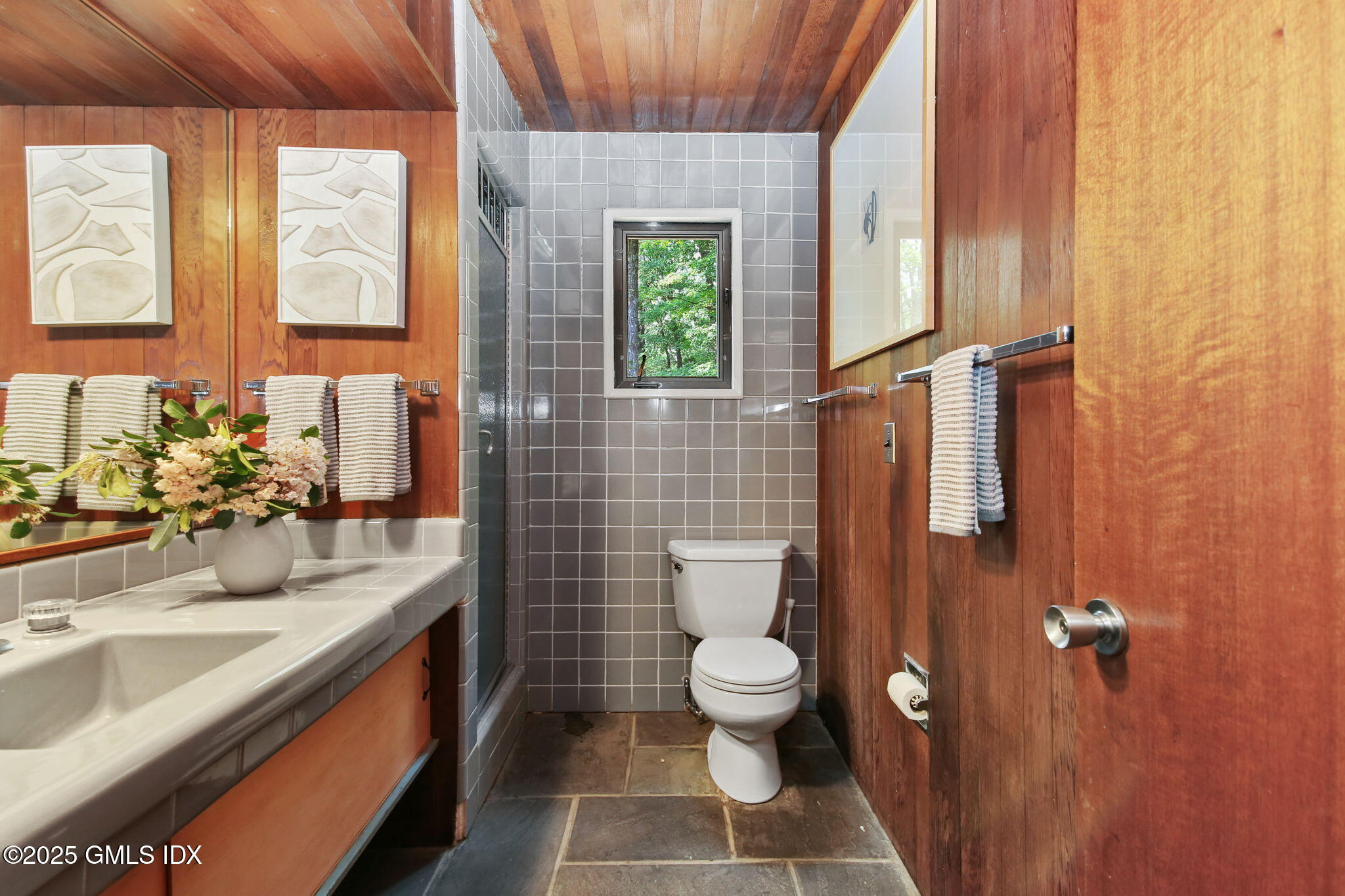 21 Hycliff Road Greenwich, CT 06831 - Photo 17 of 25 a bathroom with a sink a toilet and window
