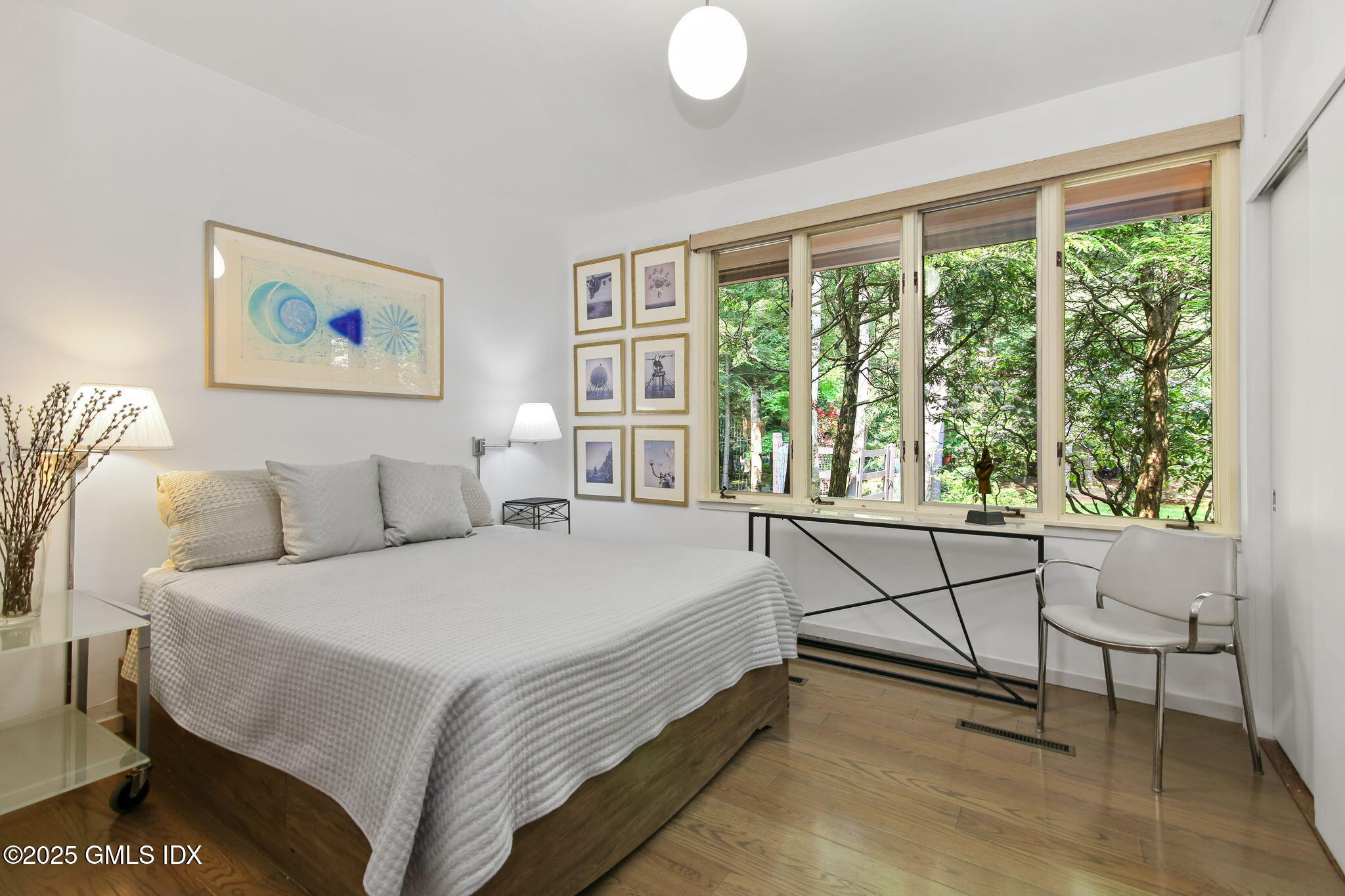 21 Hycliff Road Greenwich, CT 06831 - Photo 18 of 25 a spacious bedroom with a bed and a window