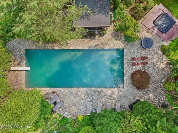 an aerial view of a house with a yard