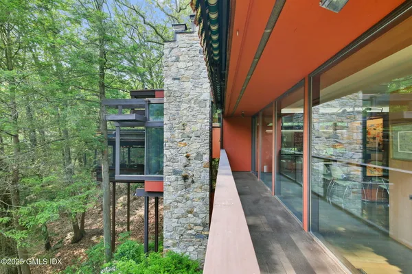 a pathway of a house with a yard