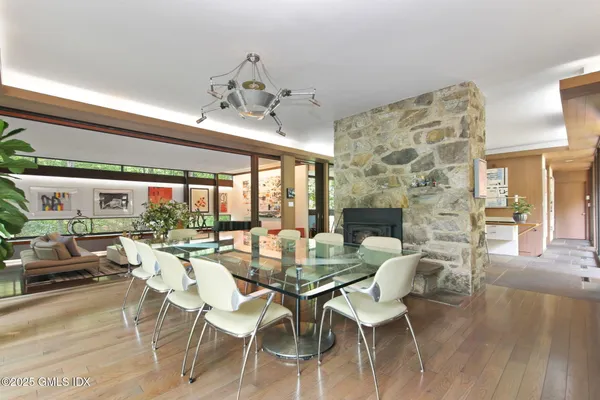 a view of a dining room with furniture wooden floor and chandelier