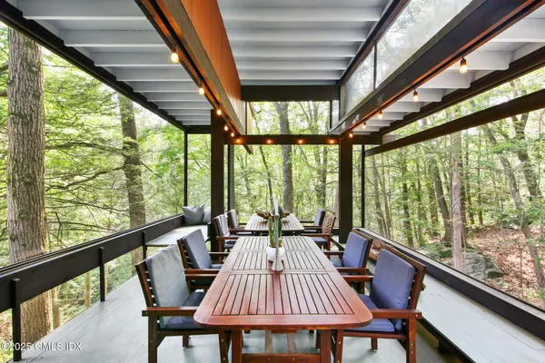 a view of balcony with furniture