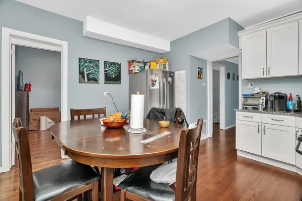 a view of a dining room with furniture and a window
