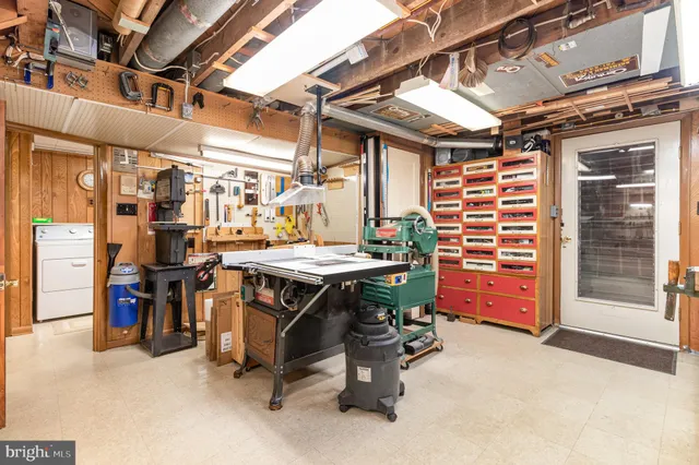 a view of dinning table and chairs in a room