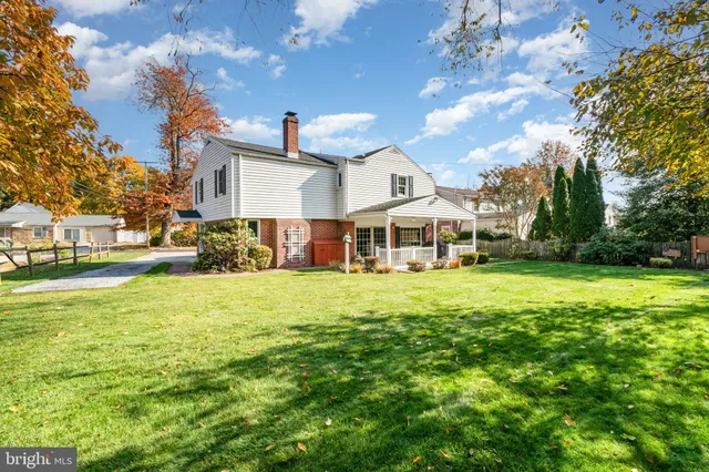 a view of a porch with wooden floor and fence