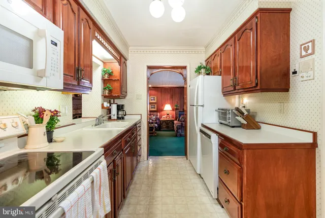 a spacious bathroom with a sink double vanity and a mirror