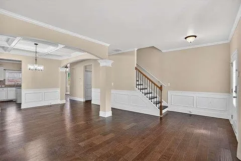 a view of entryway with stairs and wooden floor