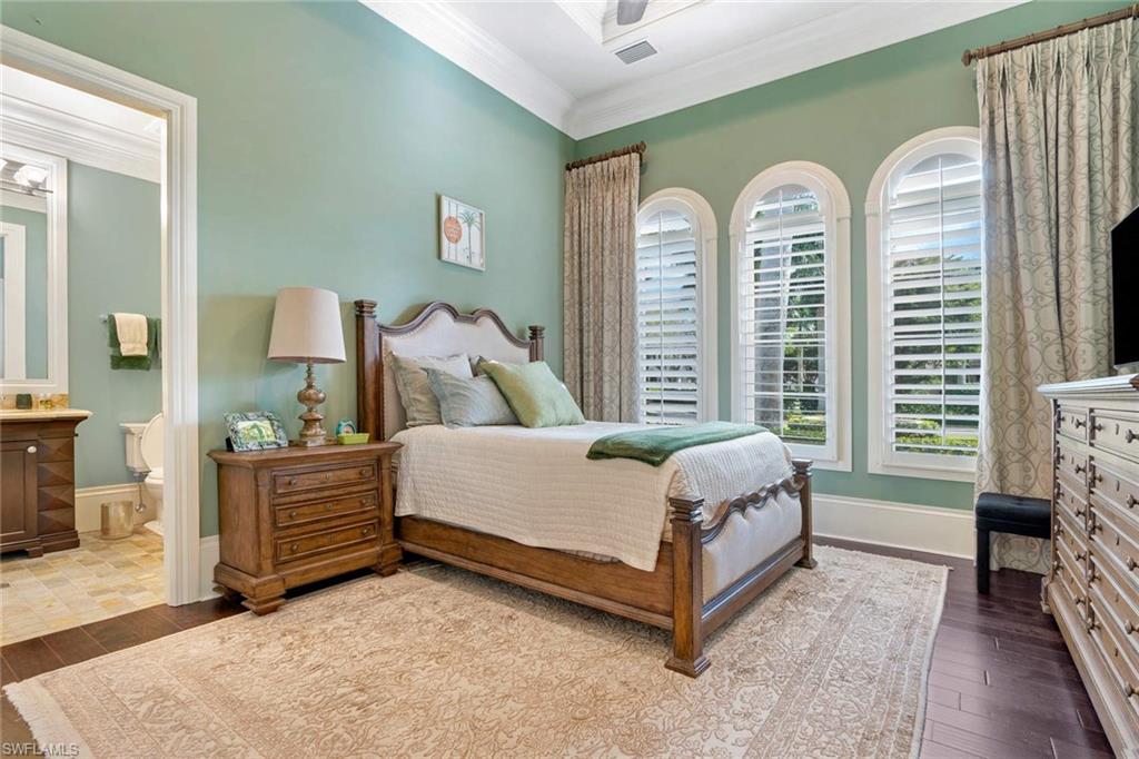 14927 Celle Way Naples, FL 34110 - Photo 16 of 31 a bed room with a bed and a chair