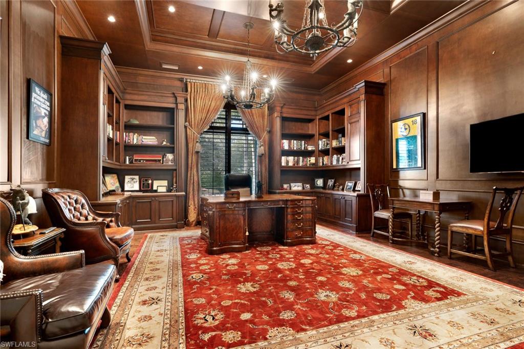 14927 Celle Way Naples, FL 34110 - Photo 21 of 31 a living room with furniture a flat screen tv and a table