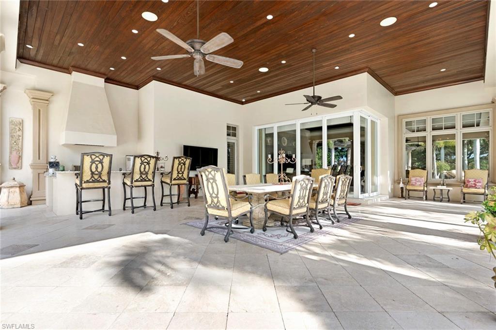 14927 Celle Way Naples, FL 34110 - Photo 24 of 31 a view of a lobby with furniture and floor to ceiling window