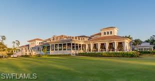 14927 Celle Way Naples, FL 34110 - Photo 29 of 31 a front view of a house with a garden and trees