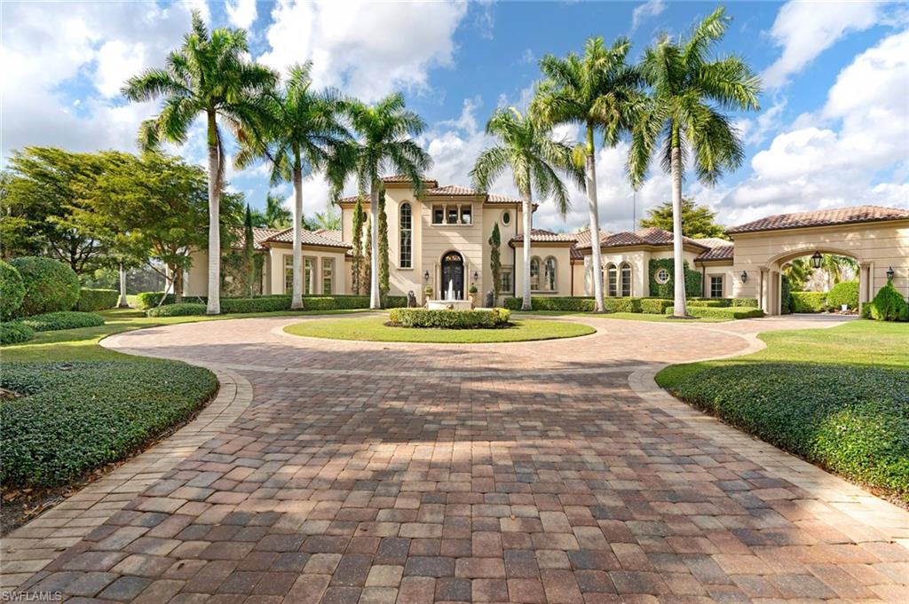 14927 Celle Way Naples, FL 34110 - Photo 6 of 31 a front view of multi story residential apartment building with yard and green space