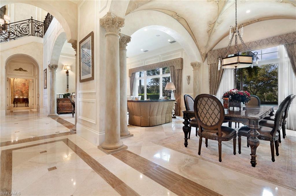 14927 Celle Way Naples, FL 34110 - Photo 9 of 31 a view of a livingroom with furniture wooden floor and a rug
