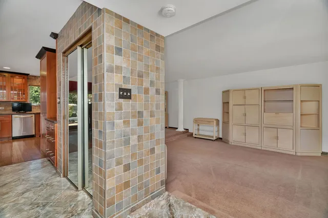 a view of a livingroom with walk in closet and bedroom