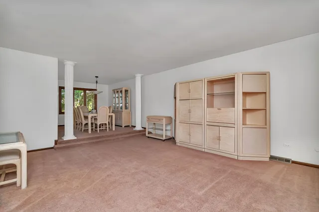 a view of an empty room with white walls