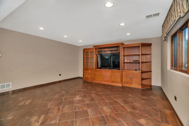 a bathroom with a sink mirror and toilet