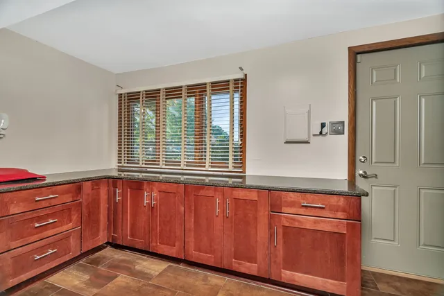 a bedroom with a bed and a television in it