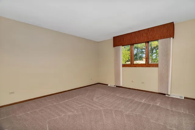 a view of workspace with furniture and window