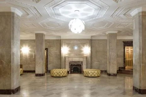 a view of a livingroom with a fireplace and window