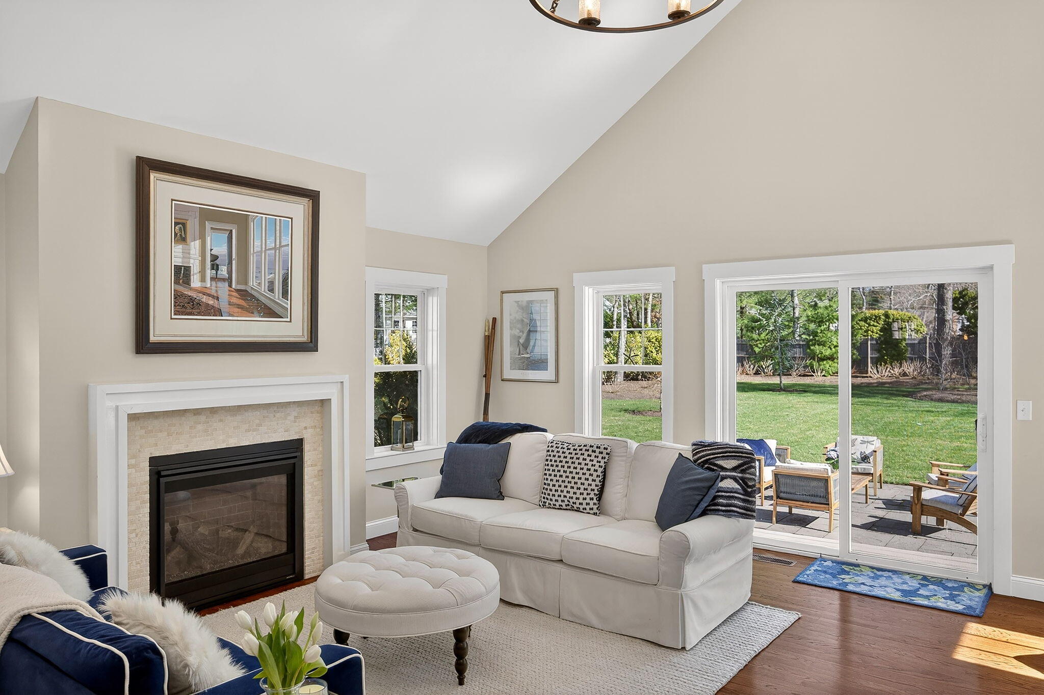 176 Bumps River Road Osterville, MA 02655 - Photo 14 of 54 a living room with furniture large window and fireplace