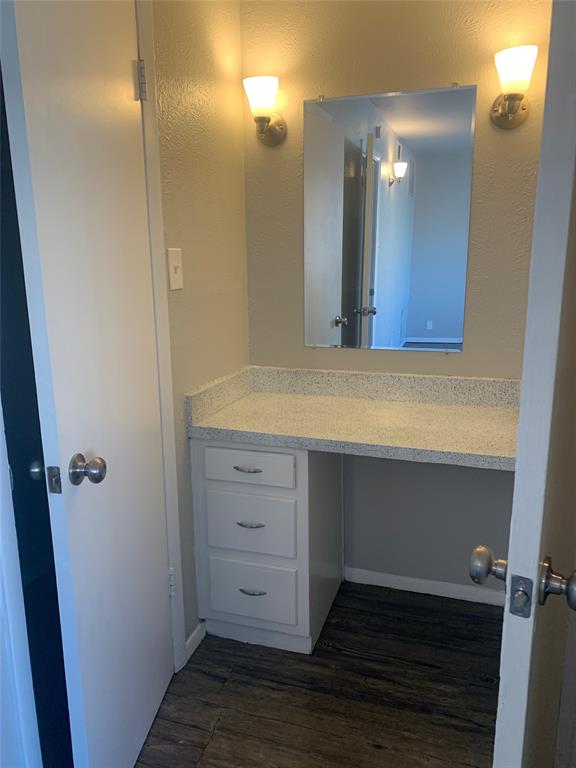 4606 Monarch Street, Unit 215 Dallas, TX 75204 - Photo 10 of 13 Bathroom with wood finished floors and vanity