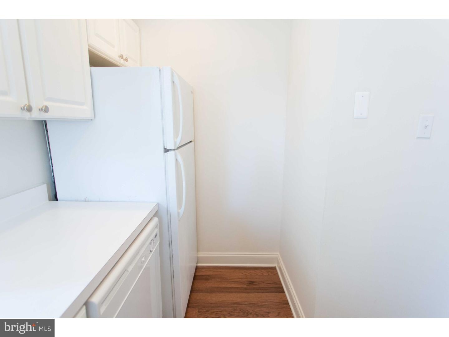 1600-7 Walnut Street, Unit 706 Philadelphia, PA 19103 - Photo 11 of 25 a kitchen with a refrigerator and a sink