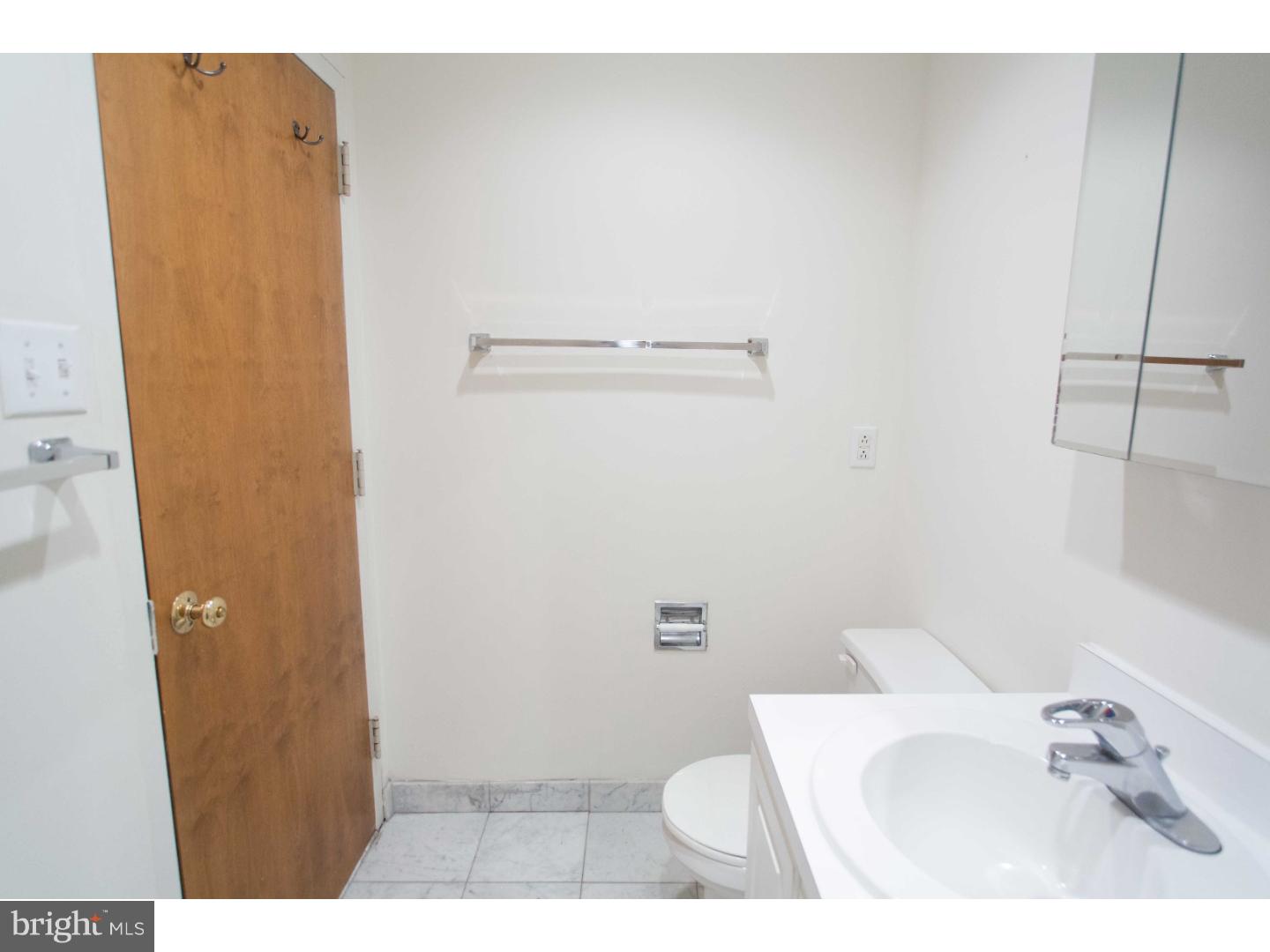1600-7 Walnut Street, Unit 706 Philadelphia, PA 19103 - Photo 16 of 25 a bathroom with a sink and toilet