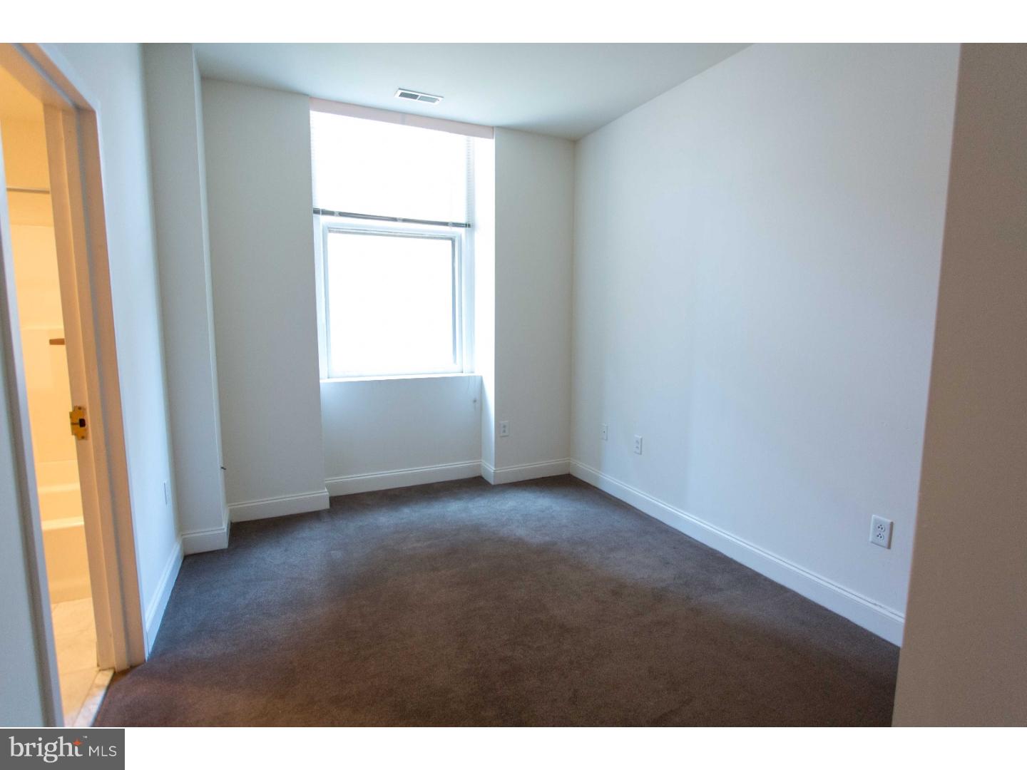 1600-7 Walnut Street, Unit 706 Philadelphia, PA 19103 - Photo 21 of 25 a view of an empty room with a window