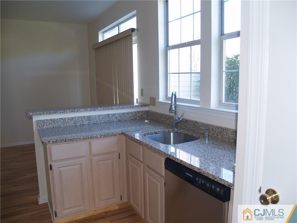18 High Pond Lane, Unit 18 Bedminster, NJ 07921 - Photo 8 of 19 a view of a kitchen sink dishwasher and window