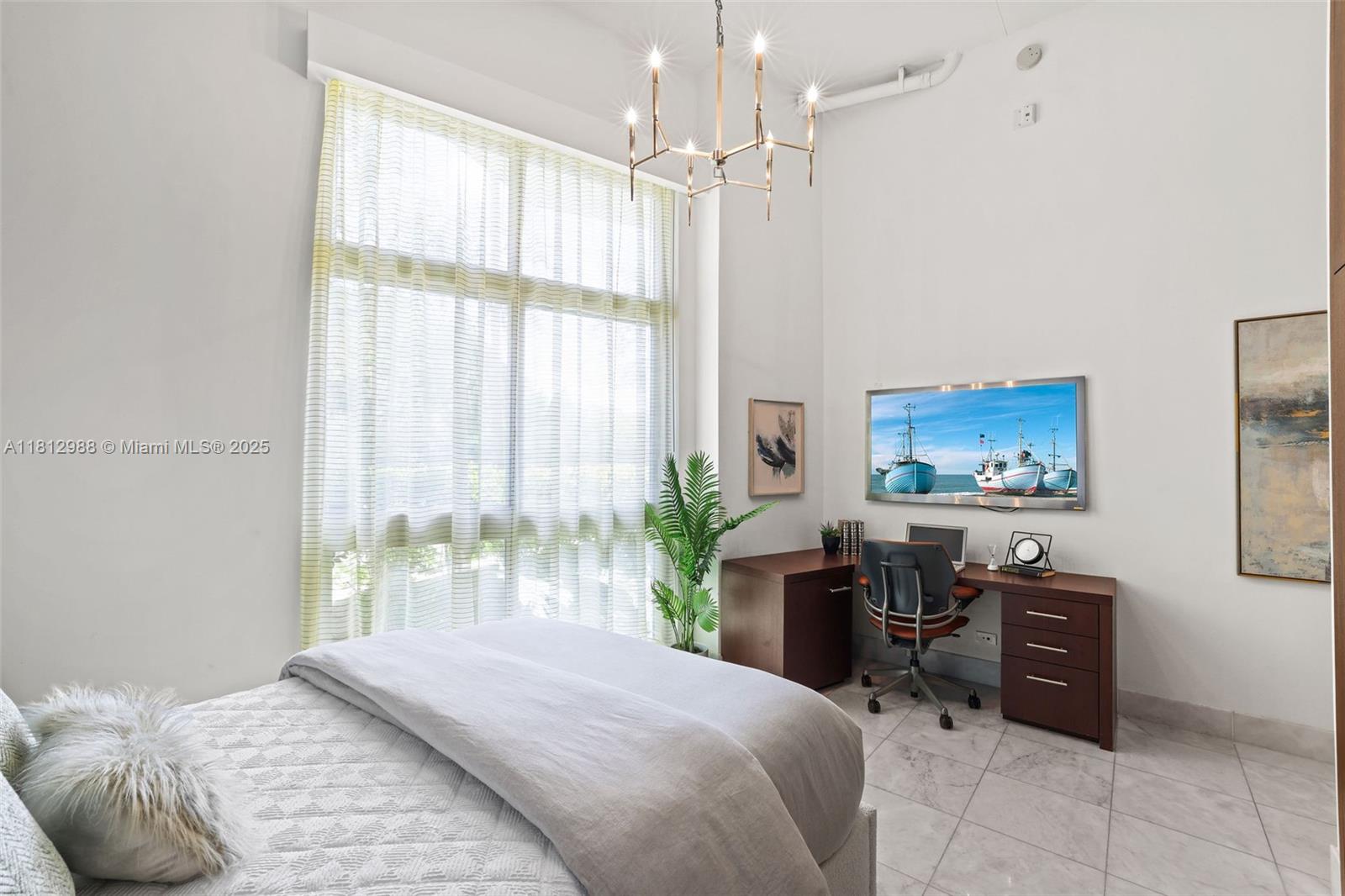 2001 Meridian Avenue, Unit 101 Miami Beach, FL 33139 - Photo 22 of 59 a bedroom with a bed and a window