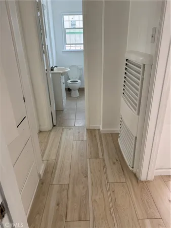 a view of a bathroom from a hallway
