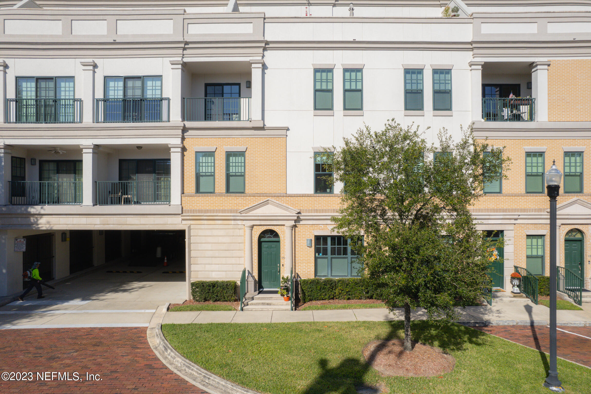 1661 Riverside Avenue, Unit 110 Jacksonville, FL 32204 - Photo 12 of 47 a front view of a building with a garden and fountain