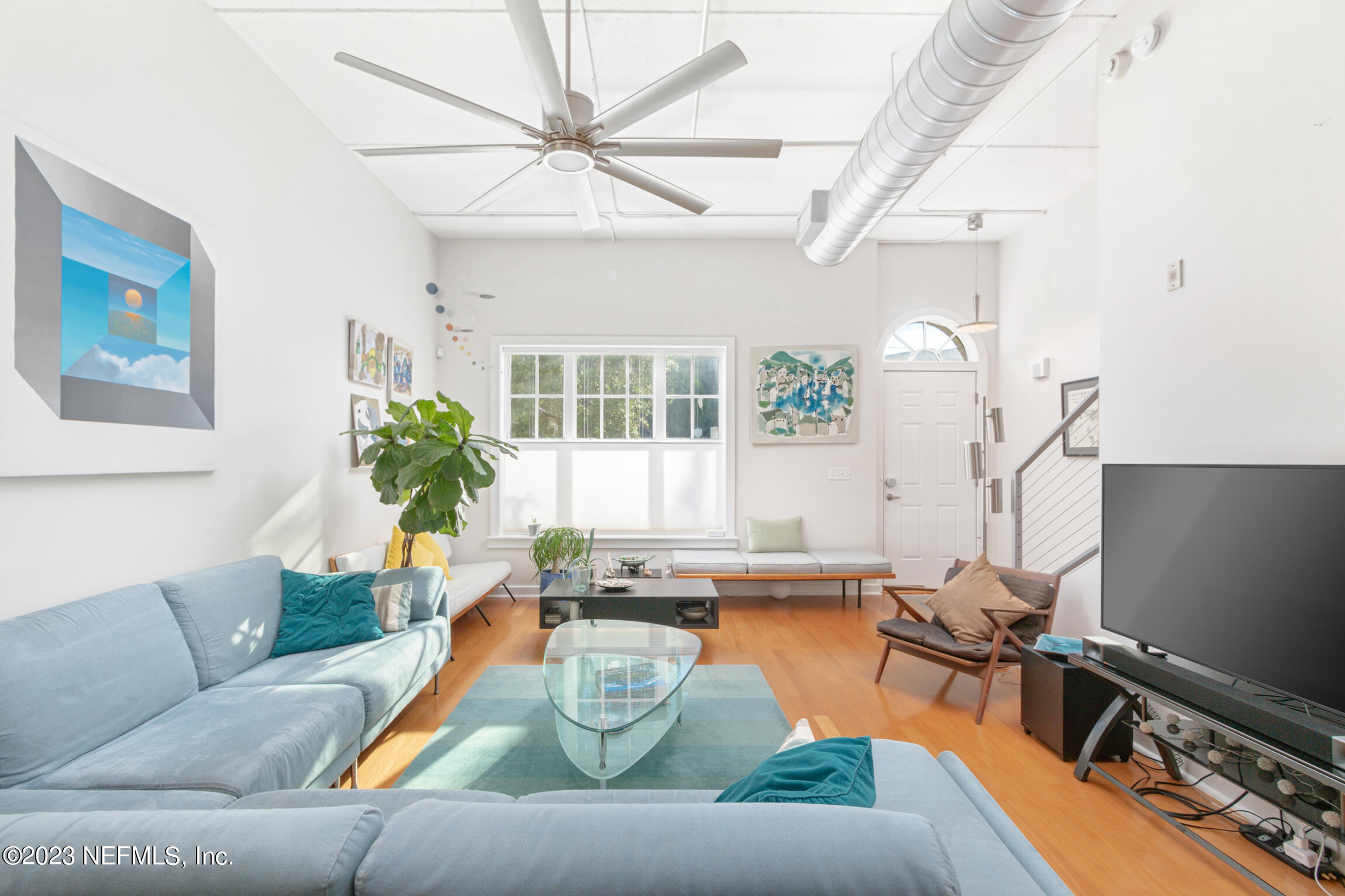 1661 Riverside Avenue, Unit 110 Jacksonville, FL 32204 - Photo 15 of 47 a living room with furniture and a flat screen tv