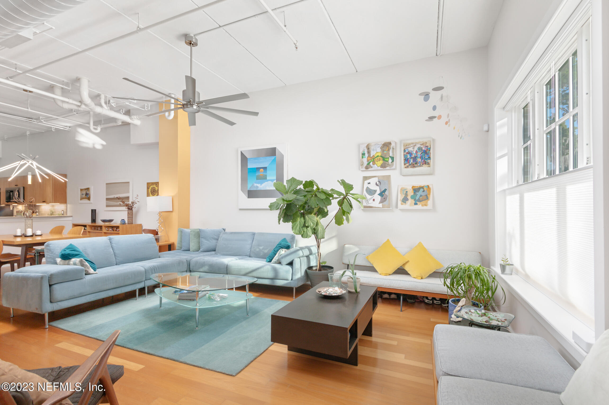 1661 Riverside Avenue, Unit 110 Jacksonville, FL 32204 - Photo 16 of 47 a living room with furniture and a large window