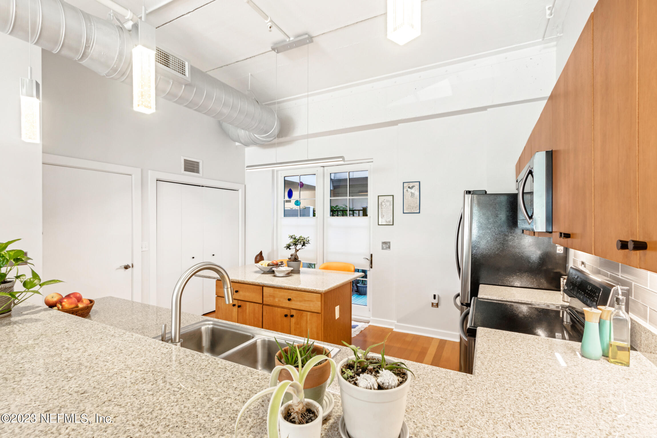1661 Riverside Avenue, Unit 110 Jacksonville, FL 32204 - Photo 25 of 47 a living room with furniture and wooden floor