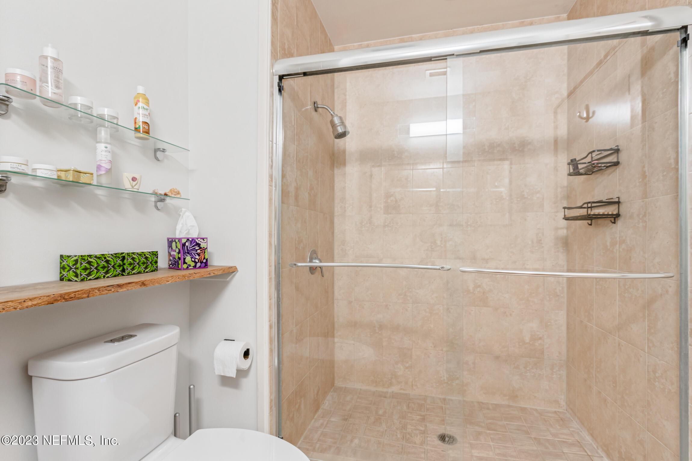 1661 Riverside Avenue, Unit 110 Jacksonville, FL 32204 - Photo 33 of 47 a bathroom with a shower a toilet and a shower