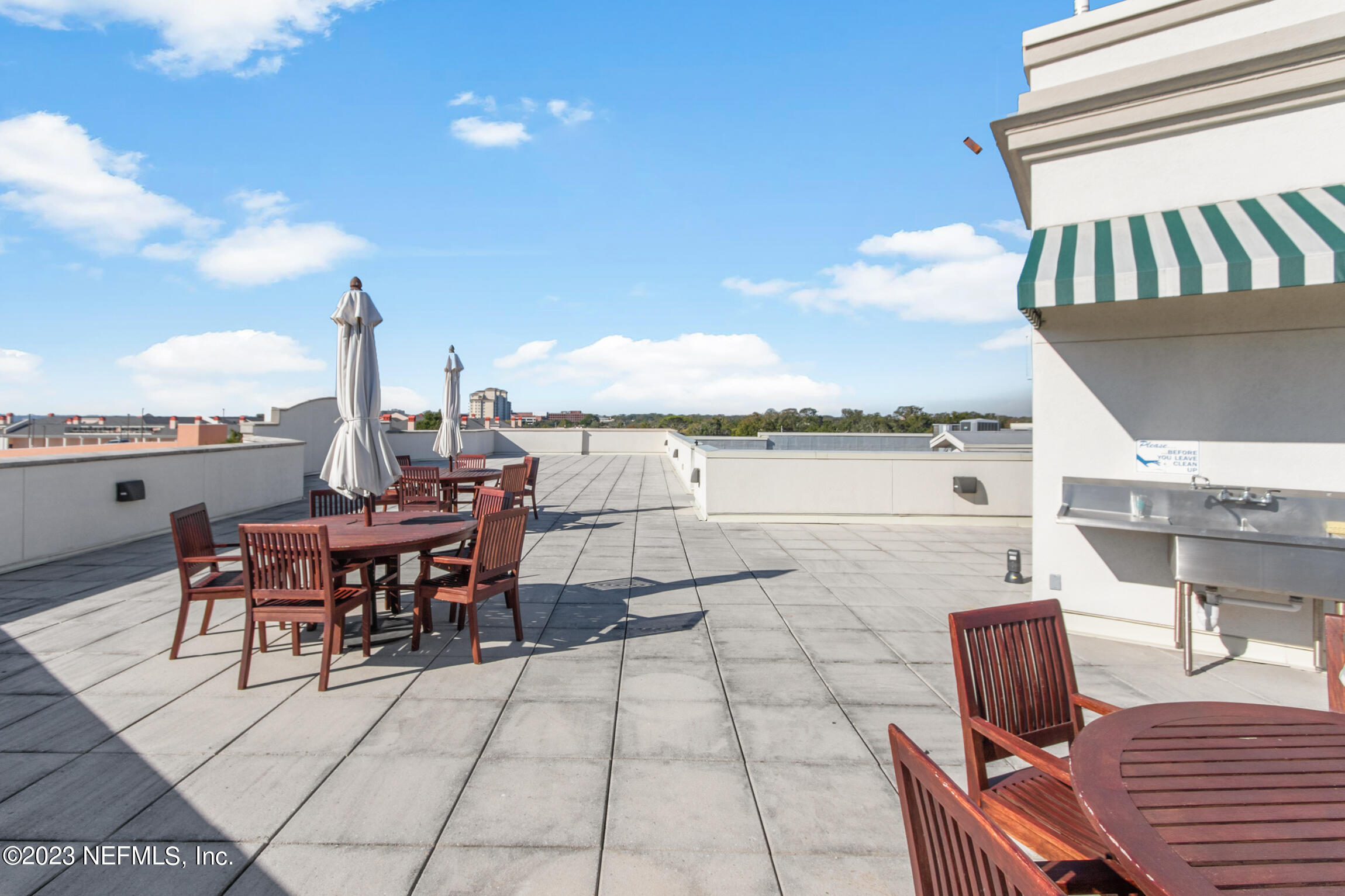 1661 Riverside Avenue, Unit 110 Jacksonville, FL 32204 - Photo 38 of 47 a view of a terrace with furniture and stove