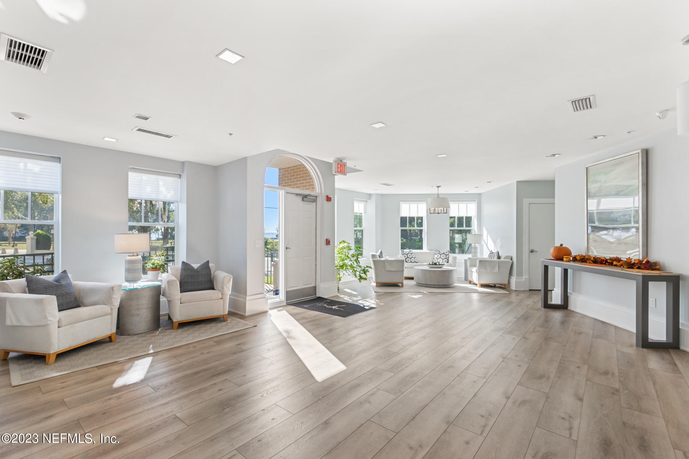 1661 Riverside Avenue, Unit 110 Jacksonville, FL 32204 - Photo 39 of 47 a living room with furniture and a wooden floor