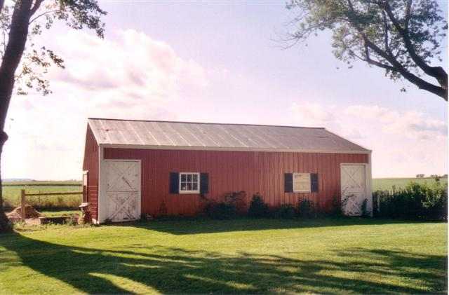 7206 North Crossroads Road Lena, IL 61048 - Photo 11 of 12 a view of a house with a swimming pool