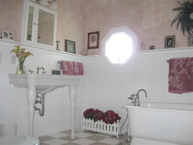 7206 North Crossroads Road Lena, IL 61048 - Photo 10 of 12 a bathroom with a sink and a mirror