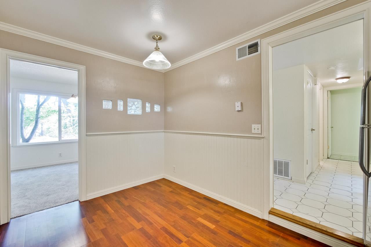 22903 Longdown Road Cupertino, CA 95014 - Photo 14 of 42 wooden floor in an empty room with a window