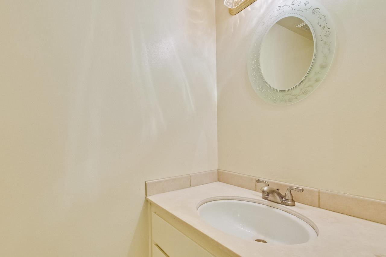 22903 Longdown Road Cupertino, CA 95014 - Photo 15 of 42 a bathroom with a sink and a mirror