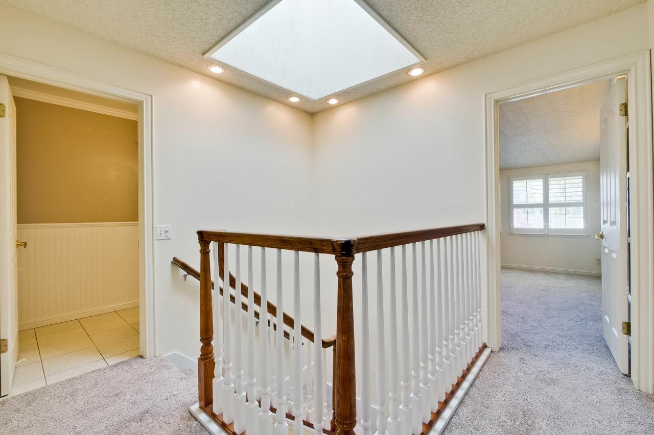 22903 Longdown Road Cupertino, CA 95014 - Photo 16 of 42 a view of a hallway with wooden floor and entryway
