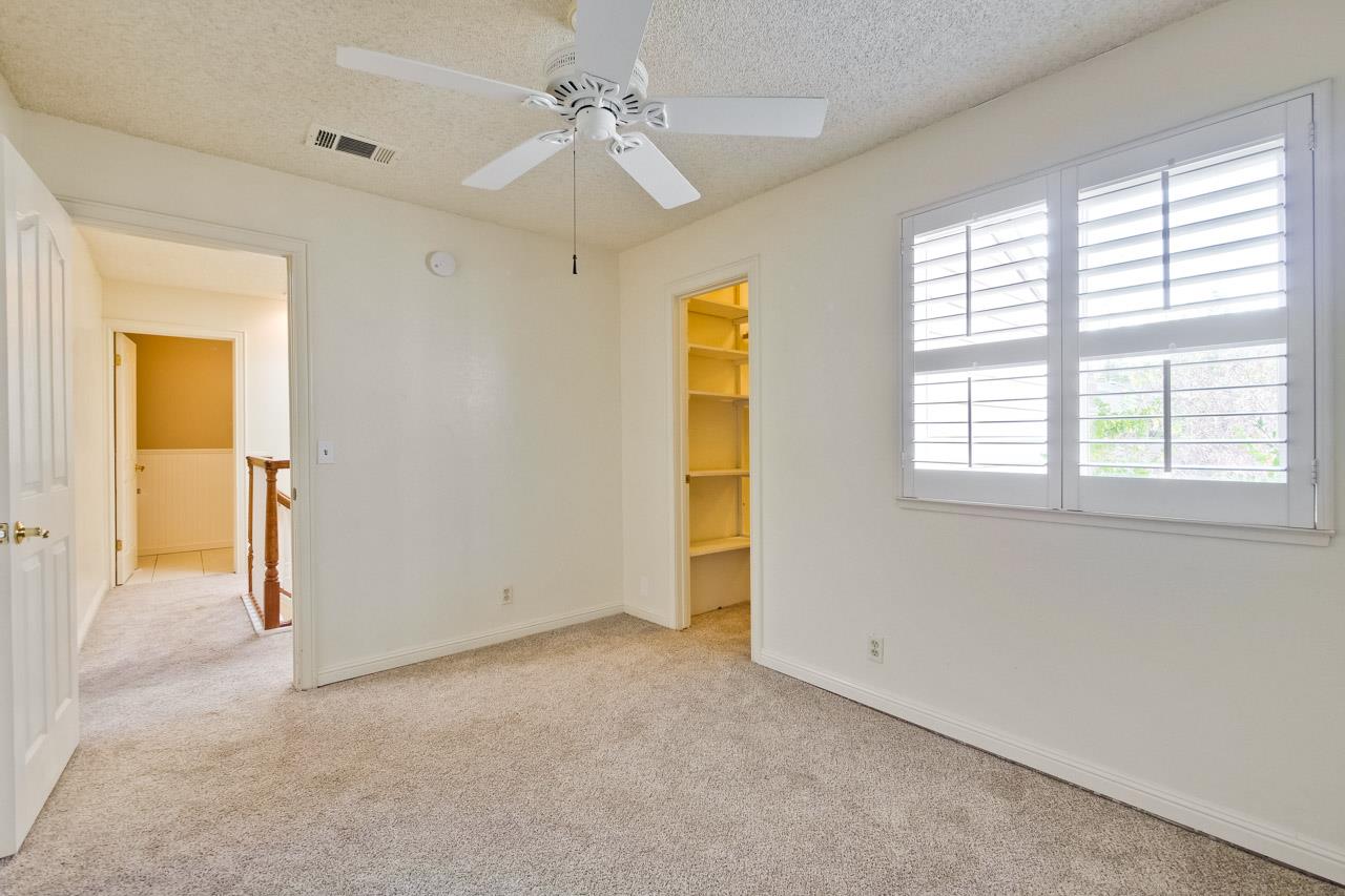 22903 Longdown Road Cupertino, CA 95014 - Photo 22 of 42 a view of an empty room with a window