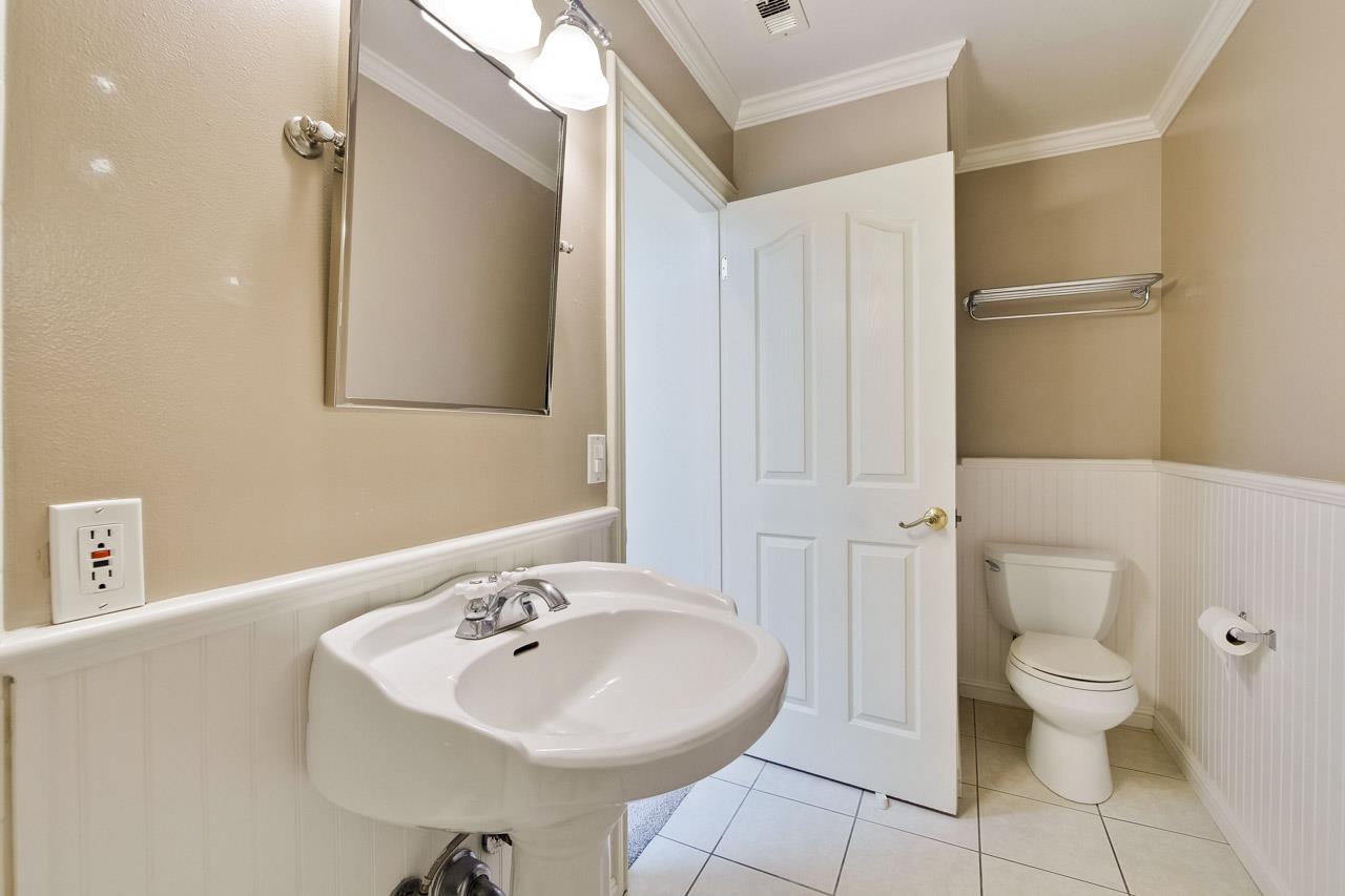 22903 Longdown Road Cupertino, CA 95014 - Photo 25 of 42 a bathroom with a sink a toilet and shower
